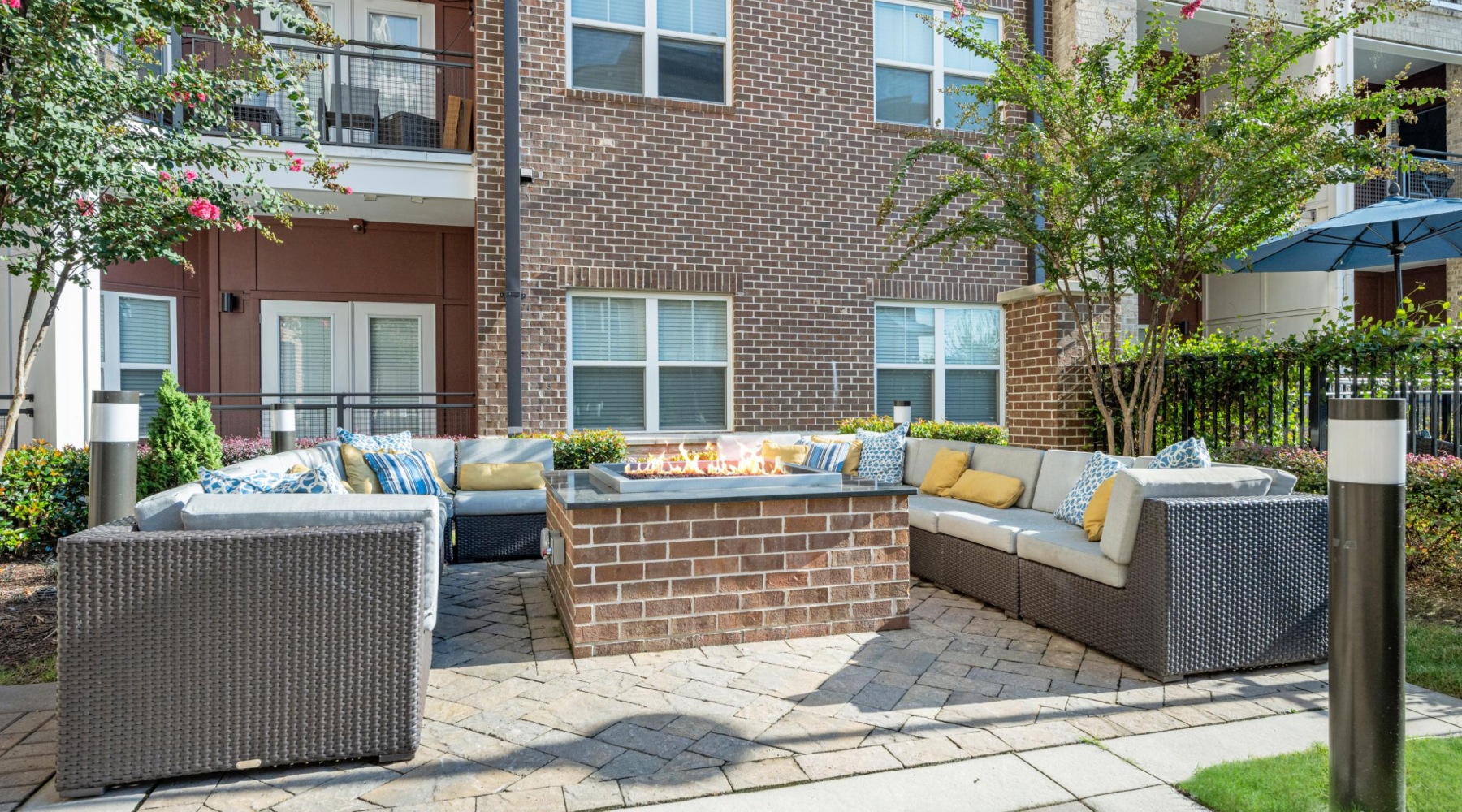 an outdoor fire pit and lounge area